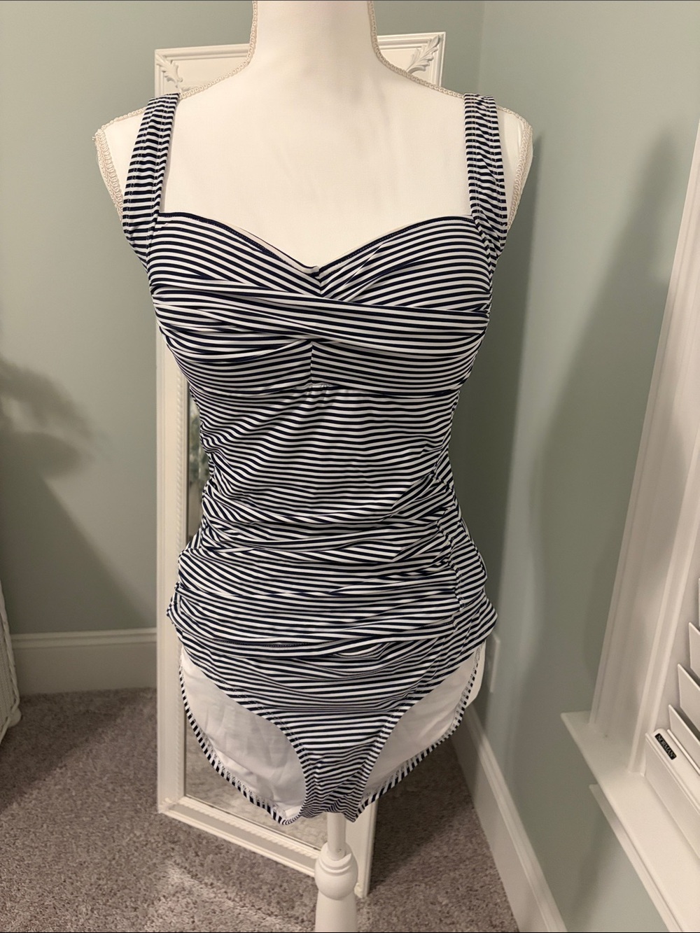 NipTuck navy and white striped tankini top and bottom, size 8.